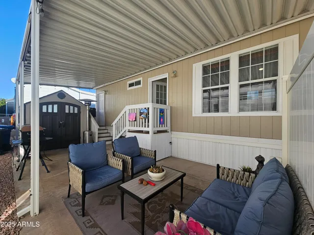 a outdoor living space with furniture and a couch