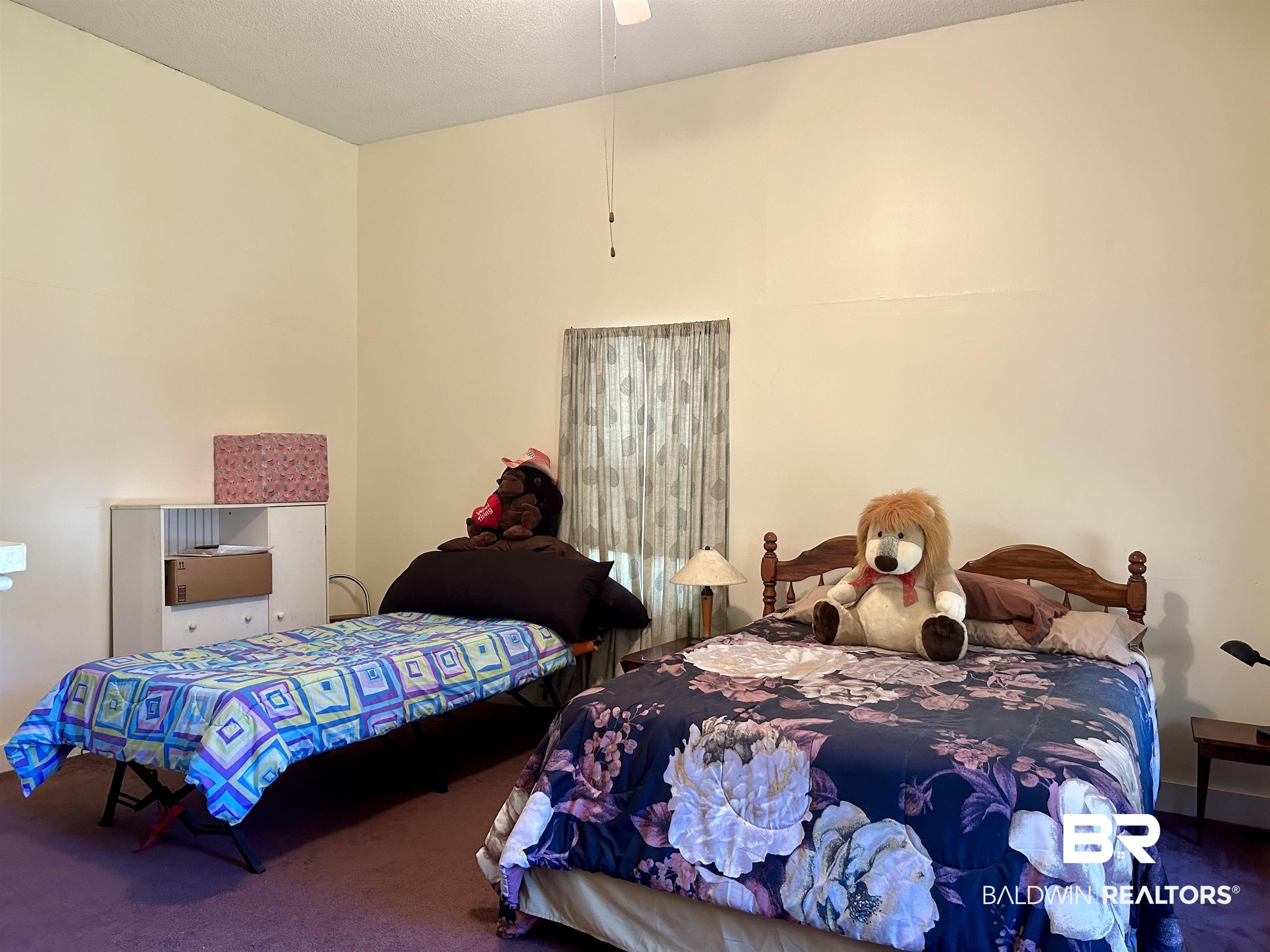 405 North Wasson Avenue Mobile, AL 36612 - Photo 15 of 26 Bedroom with ceiling fan and carpet floors