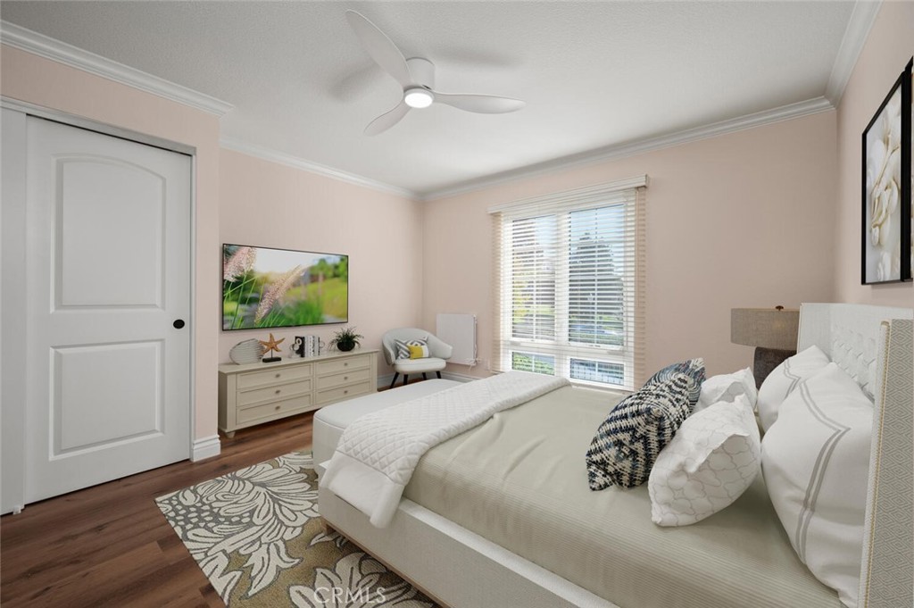 300 Cagney Lane, Unit 102 Newport Beach, CA 92663 - Photo 12 of 28 a bedroom with a bed and a dresser