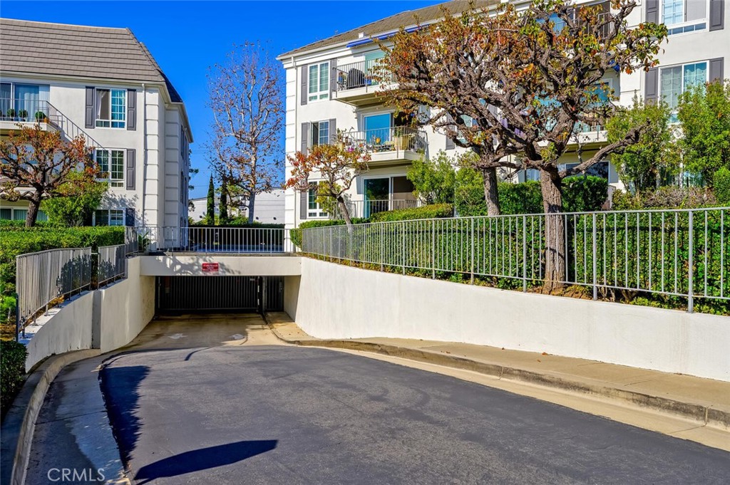300 Cagney Lane, Unit 102 Newport Beach, CA 92663 - Photo 19 of 28 a house view with a garden space
