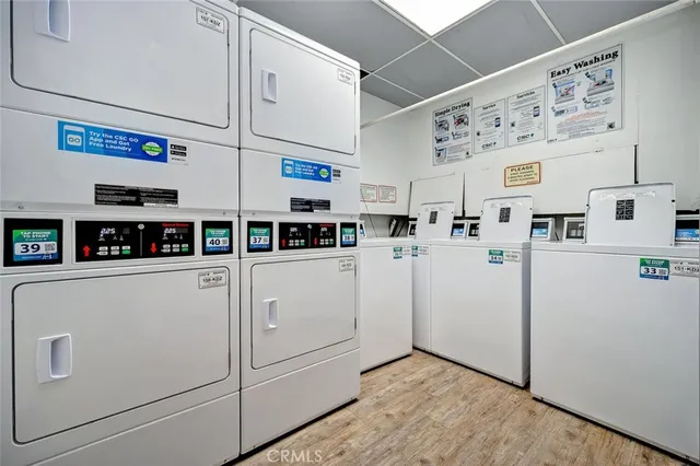 a kitchen with refrigerator and cabinets