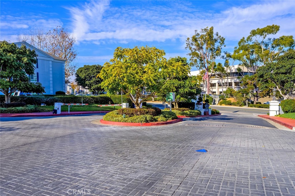 300 Cagney Lane, Unit 102 Newport Beach, CA 92663 - Photo 27 of 28 a view of a park with plants and a bench