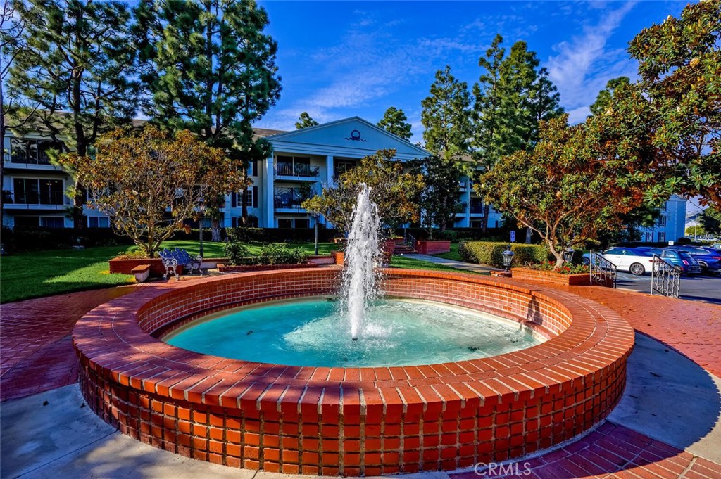 300 Cagney Lane, Unit 102 Newport Beach, CA 92663 - Photo 28 of 28 a view of a swimming pool with a patio
