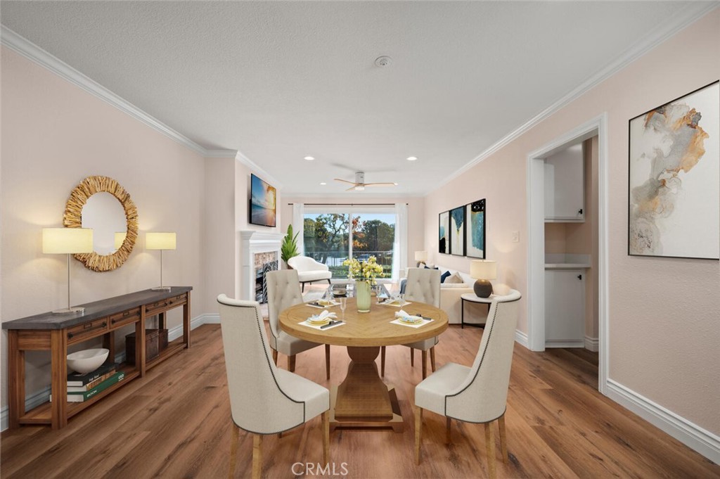 300 Cagney Lane, Unit 102 Newport Beach, CA 92663 - Photo 6 of 28 a view of a dining room with furniture window and wooden floor