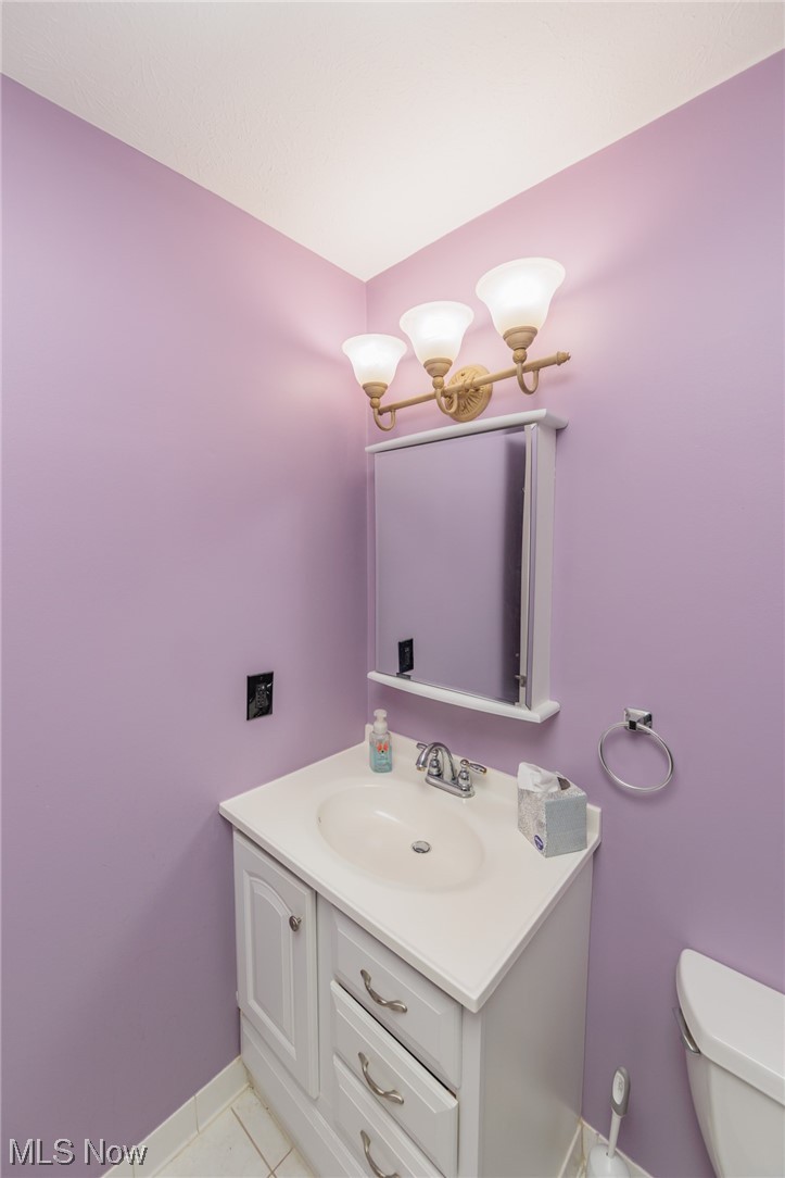 6472 State Road, Unit J19 Parma, OH 44134 - Photo 20 of 33 Bathroom with toilet, tile flooring, and vanity