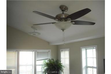 10812 Newport Mill Road Kensington, MD 20895 - Photo 1 of 24 a view of a big room with windows and chandelier fan