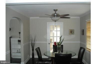 10812 Newport Mill Road Kensington, MD 20895 - Photo 20 of 24 a view of a dining room with furniture and window