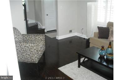 10812 Newport Mill Road Kensington, MD 20895 - Photo 5 of 24 a living room with furniture and wooden floor