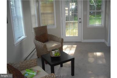 10812 Newport Mill Road Kensington, MD 20895 - Photo 7 of 24 a living room with furniture and a window