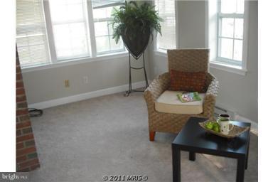 10812 Newport Mill Road Kensington, MD 20895 - Photo 10 of 24 a living room with furniture and a window