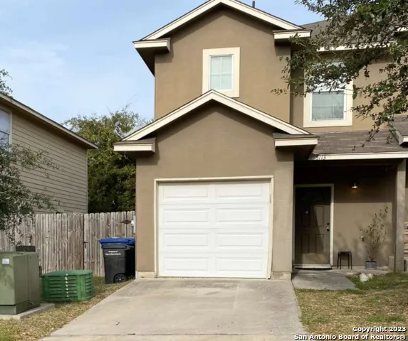 a view of a house with a garage