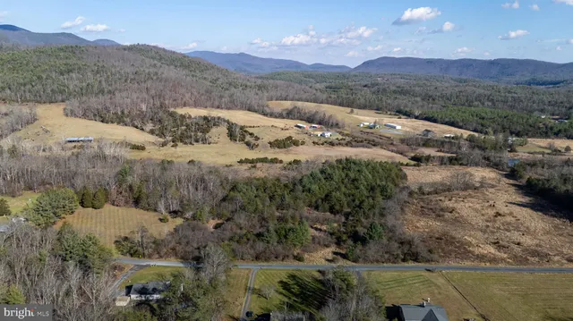a view of a town with mountains