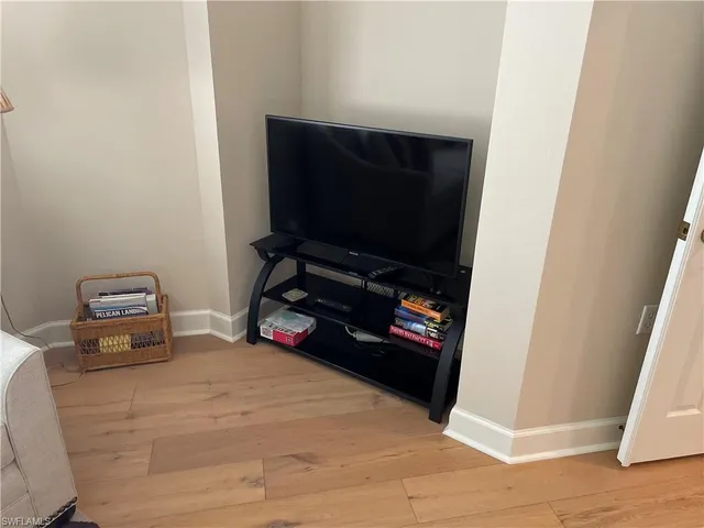 a room with furniture and a flat screen tv