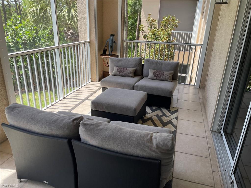 23781 Merano Court, Unit 201 Estero, FL 34134 - Photo 24 of 29 a living room with furniture and a window