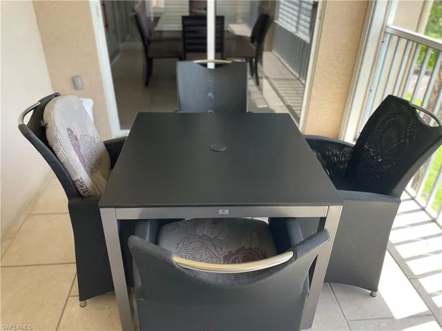 a view of roof deck with chair and front door