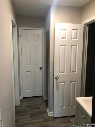 a view of a bathroom with wooden floor