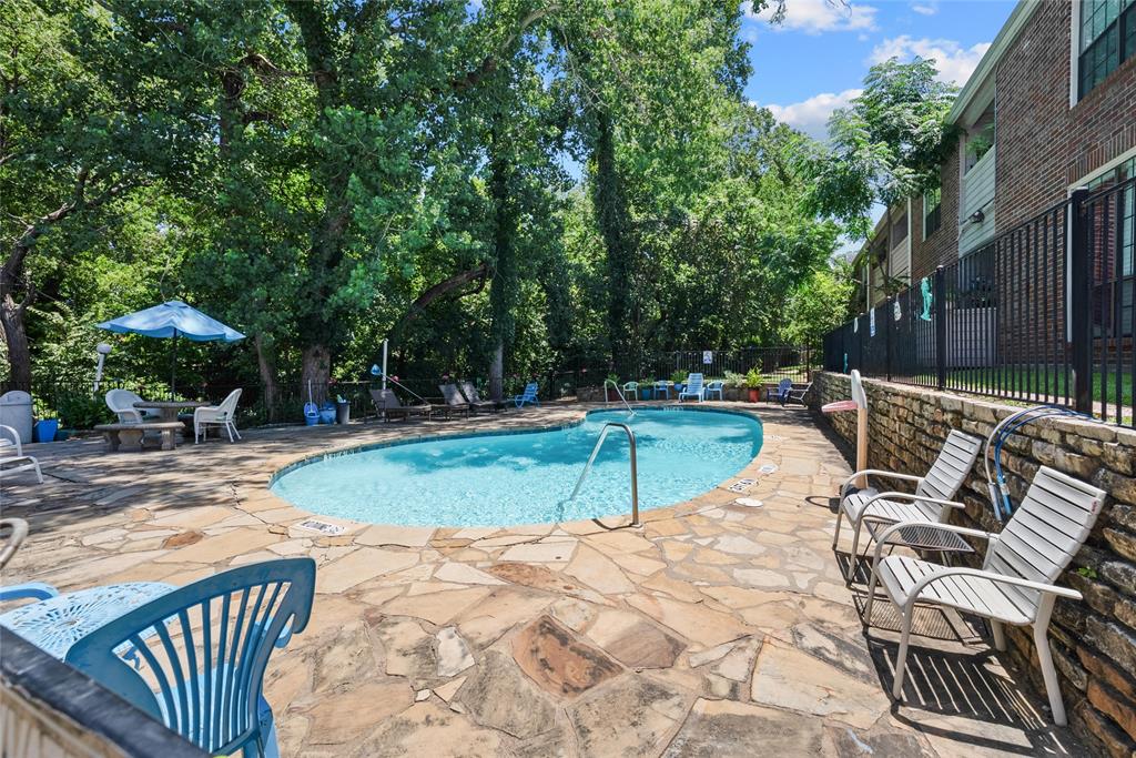 8545 Midpark Road, Unit 47 Dallas, TX 75240 - Photo 10 of 10 a view of a swimming pool with a patio