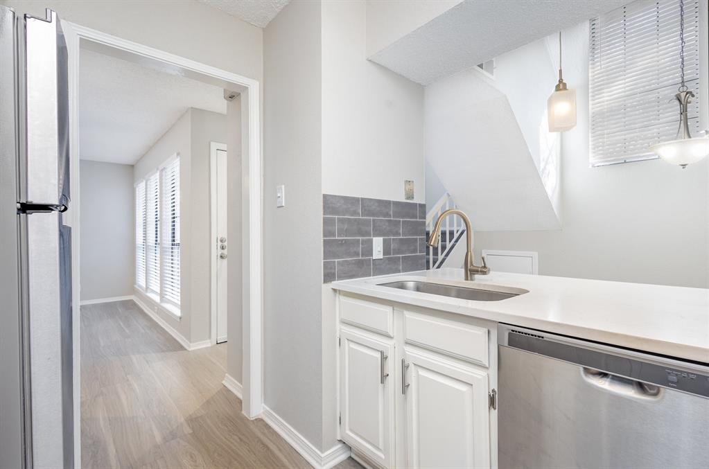 18240 Midway Road, Unit 204 Dallas, TX 75287 - Photo 11 of 21 a bathroom with a sink and mirror