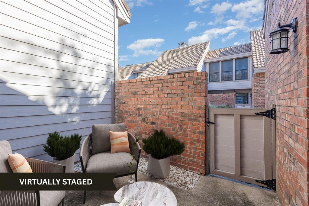 18240 Midway Road, Unit 204 Dallas, TX 75287 - Photo 2 of 21 a view of a patio with couches and a potted plant on a street