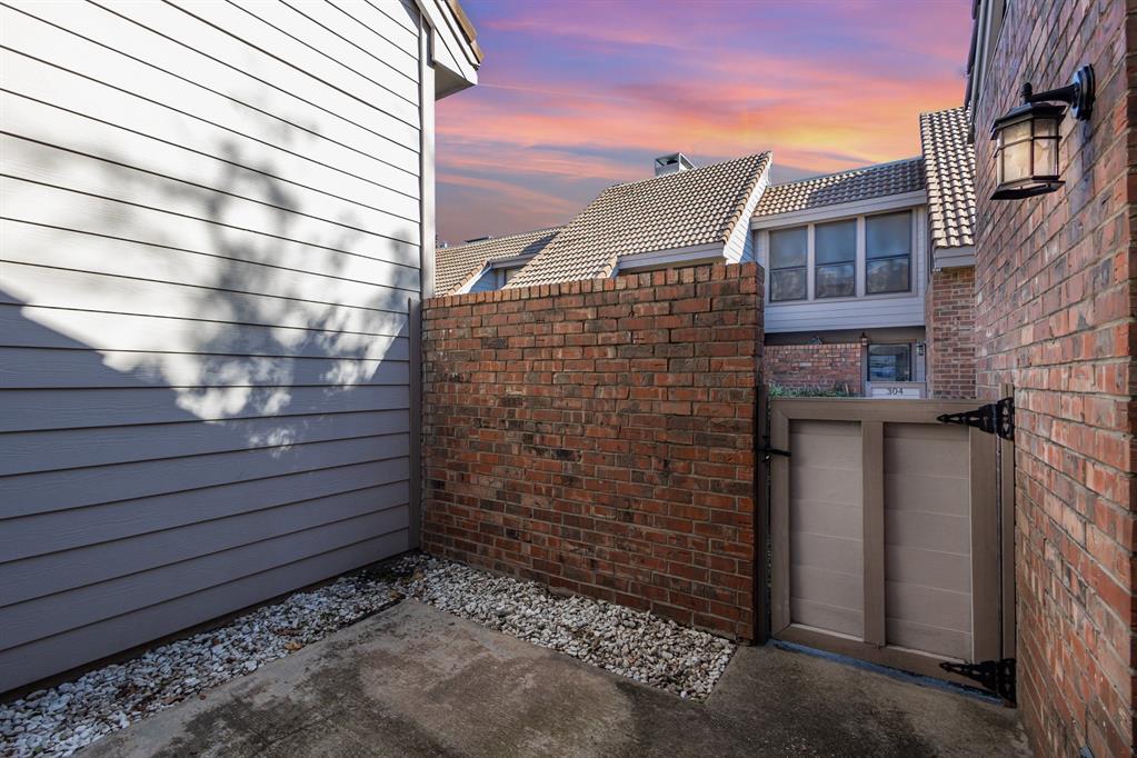 18240 Midway Road, Unit 204 Dallas, TX 75287 - Photo 21 of 21 a view of a brick building with an empty space