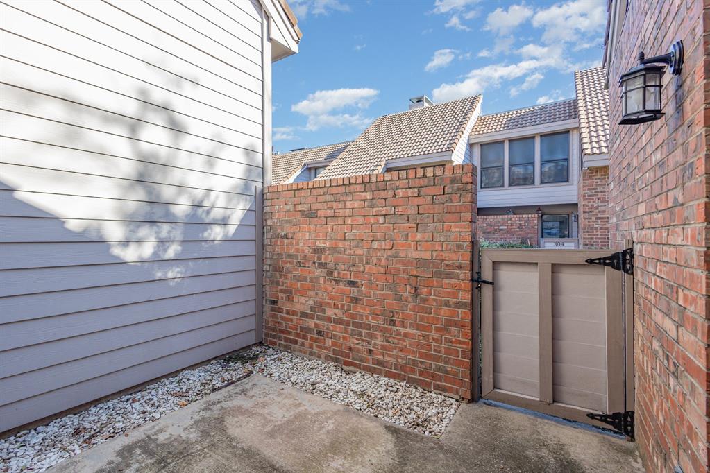 18240 Midway Road, Unit 204 Dallas, TX 75287 - Photo 3 of 21 a view of a brick building