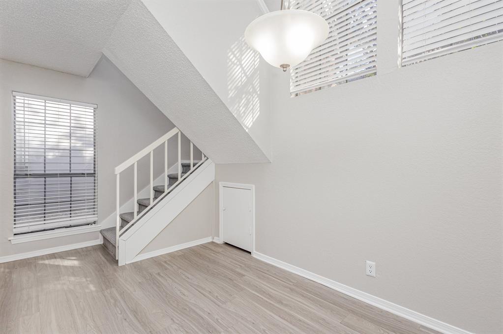 18240 Midway Road, Unit 204 Dallas, TX 75287 - Photo 8 of 21 a view of entryway with wooden floor