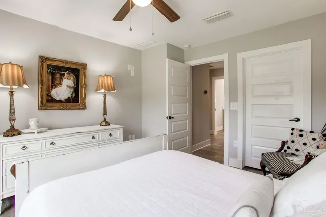 a bedroom with a bed and a dresser