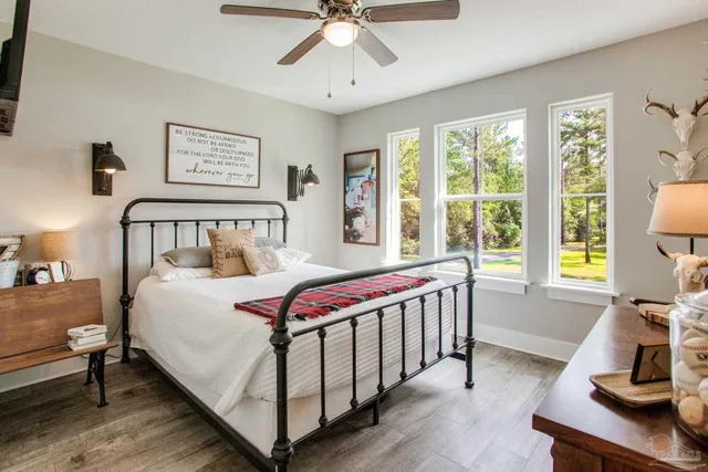 a bedroom with a bed and a desk