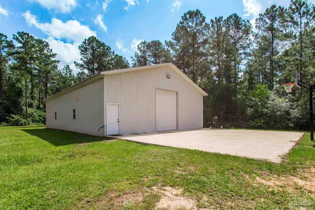a backyard of a house with lots of green space