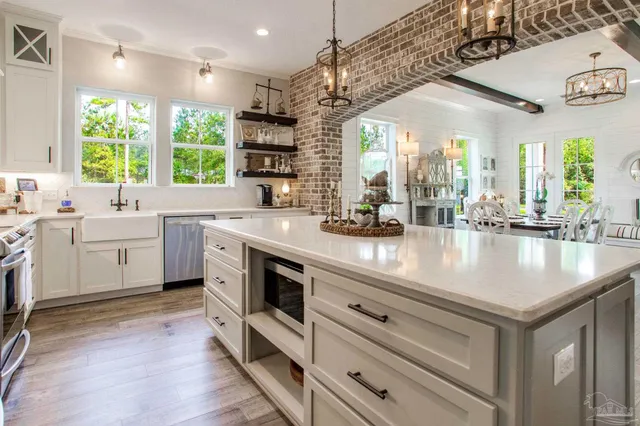 a kitchen with a sink stove and cabinets