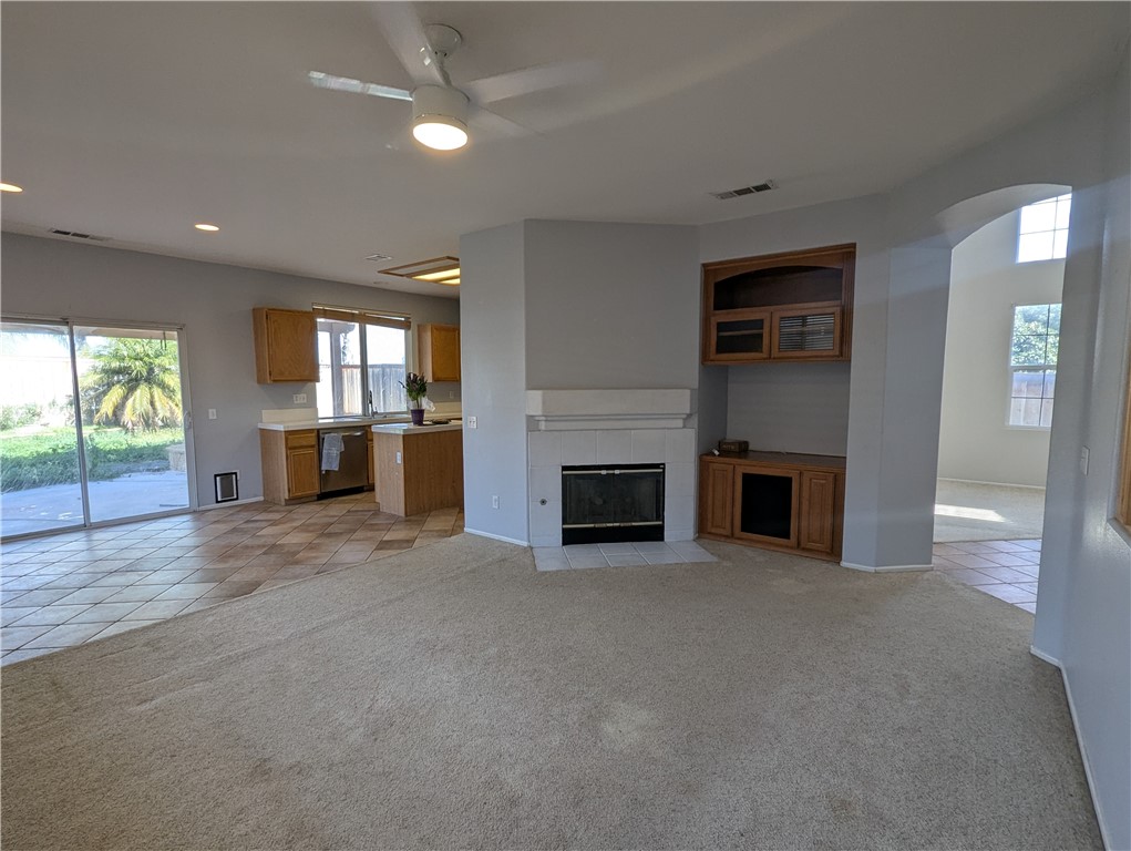 44601 Crestwood Circle Temecula, CA 92592 - Photo 11 of 46 an empty room with furniture and a fireplace