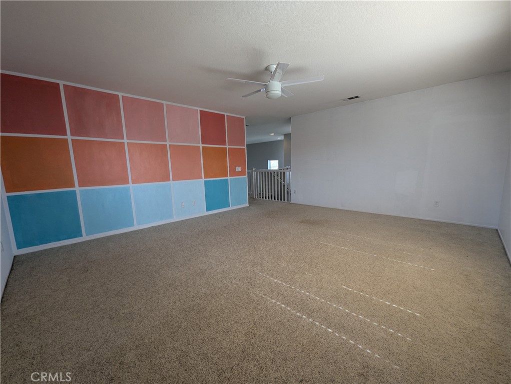 44601 Crestwood Circle Temecula, CA 92592 - Photo 18 of 46 a view of an empty room with a cabinet and a window