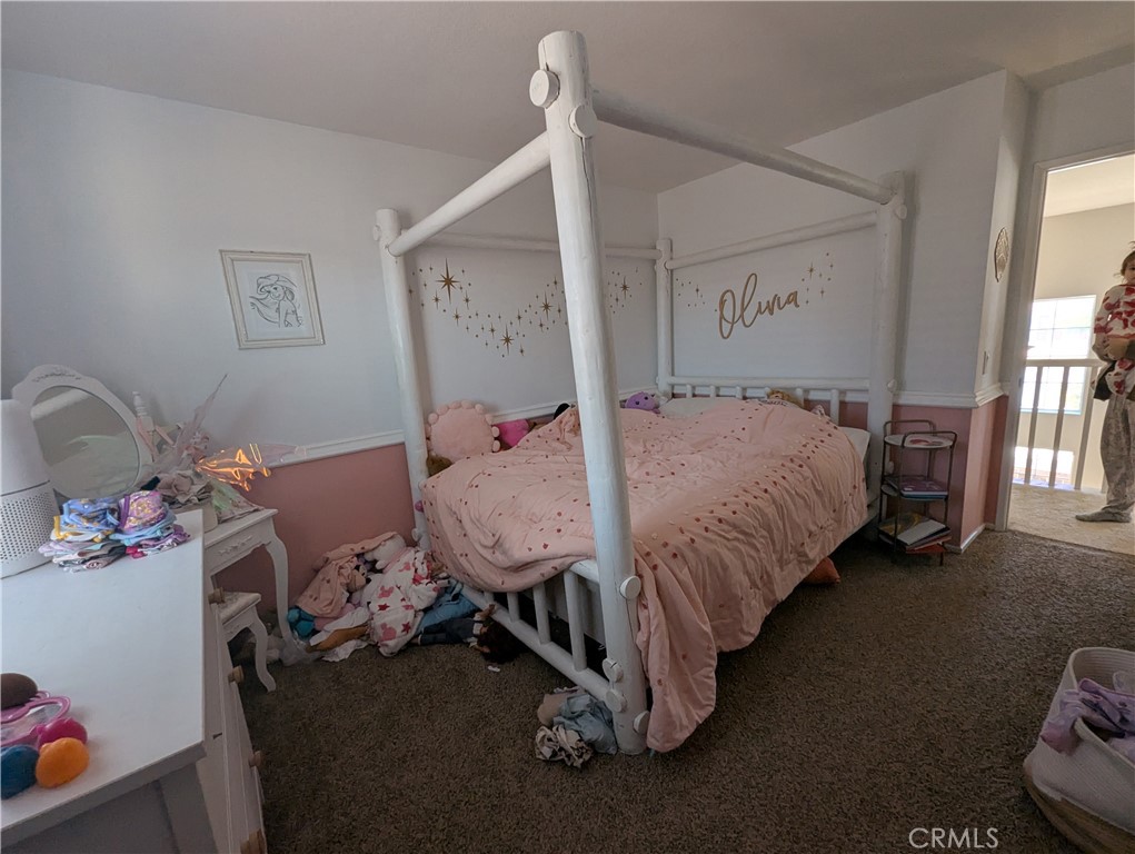 44601 Crestwood Circle Temecula, CA 92592 - Photo 20 of 46 a bed room with a bed and a baby crib