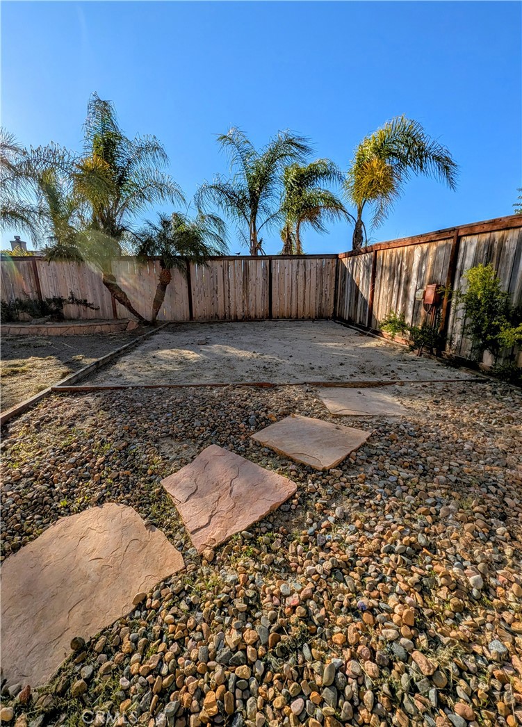 44601 Crestwood Circle Temecula, CA 92592 - Photo 39 of 46 a view of a backyard with wooden fence