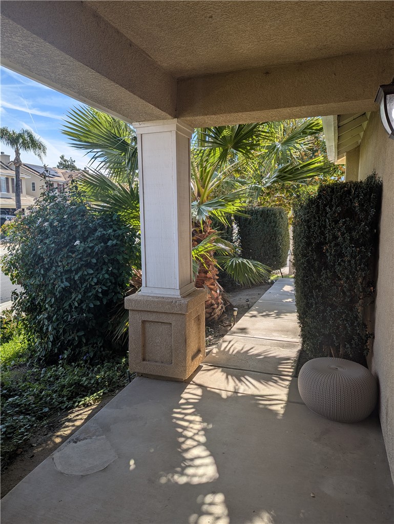 44601 Crestwood Circle Temecula, CA 92592 - Photo 4 of 46 a view of a porch with furniture and a yard