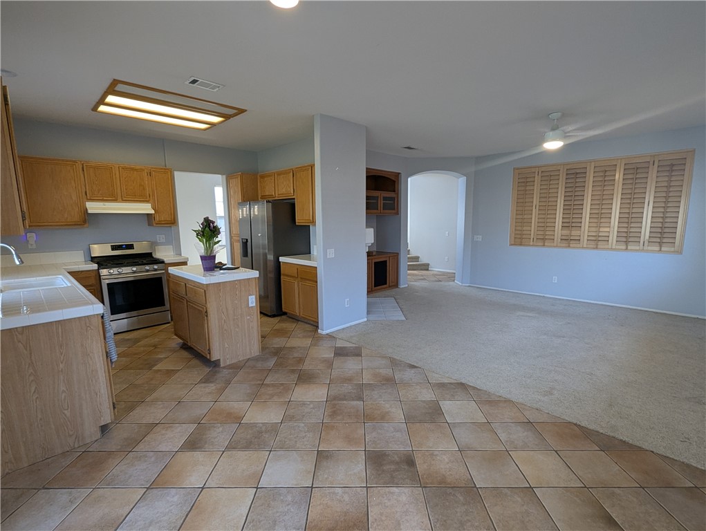 44601 Crestwood Circle Temecula, CA 92592 - Photo 9 of 46 a view of a kitchen with furniture and windows