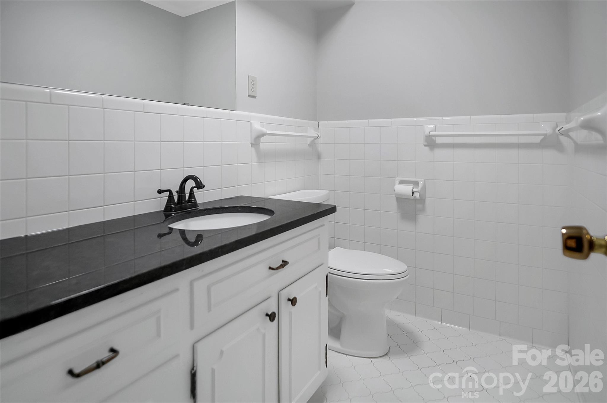 808 Old Mt Holly Road Stanley, NC 28164 - Photo 27 of 48 a bathroom with a sink a toilet and a shower