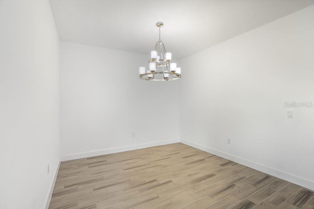 5375 Spoonflower Court St. Cloud, FL 34771 - Photo 12 of 42 a view of a chandelier in an empty room