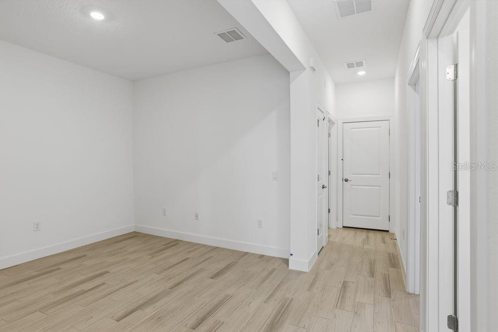 5375 Spoonflower Court St. Cloud, FL 34771 - Photo 16 of 42 a view of a room with wooden floor