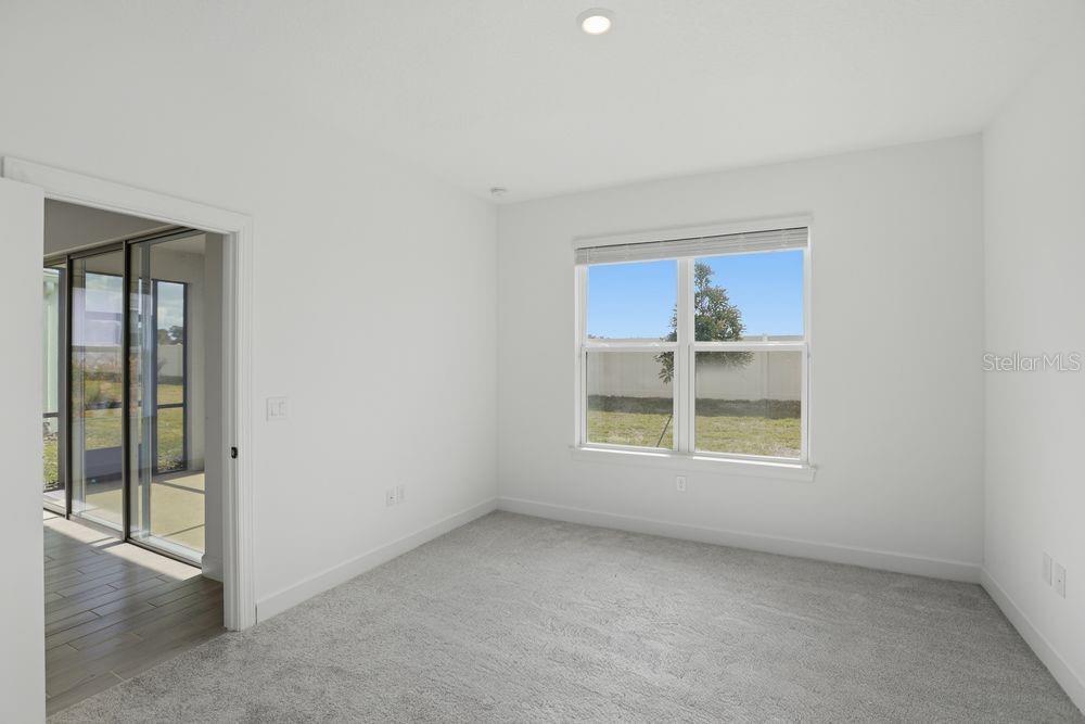 5375 Spoonflower Court St. Cloud, FL 34771 - Photo 18 of 42 an empty room with a window