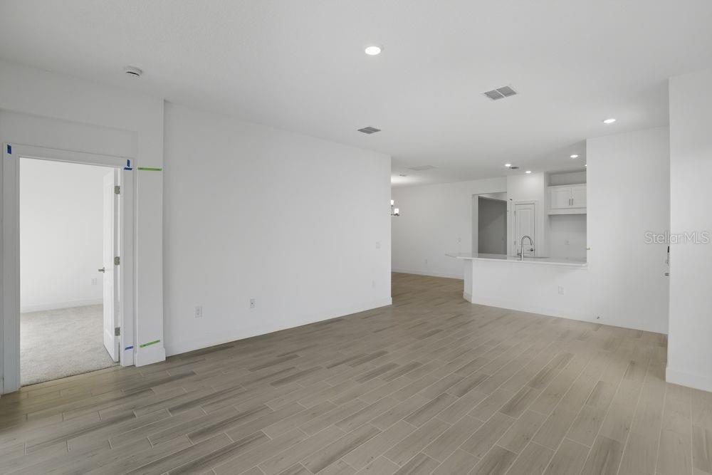 5375 Spoonflower Court St. Cloud, FL 34771 - Photo 10 of 42 a view of kitchen with a sink and wooden floor