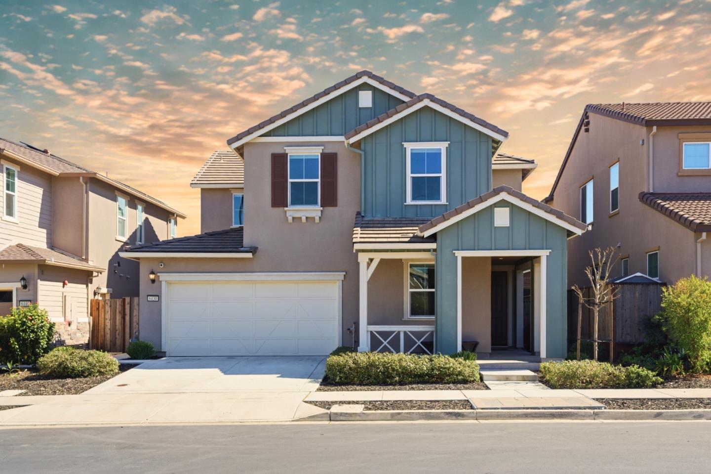 6430 Godani Street Gilroy, CA 95020 - Photo 1 of 38 a front view of a house with a yard and garage
