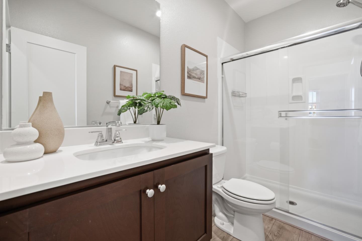 6430 Godani Street Gilroy, CA 95020 - Photo 15 of 38 a bathroom with a sink a toilet and shower