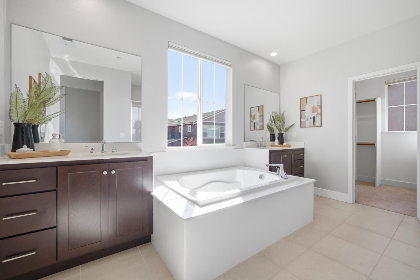 6430 Godani Street Gilroy, CA 95020 - Photo 27 of 38 a spacious bathroom with a tub sink and mirror