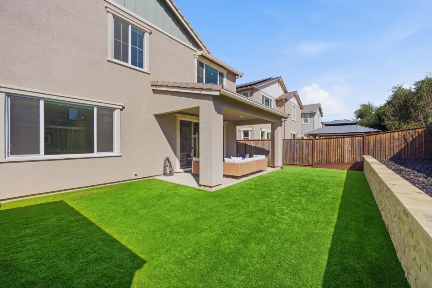 6430 Godani Street Gilroy, CA 95020 - Photo 30 of 38 a view of a house with a yard and deck