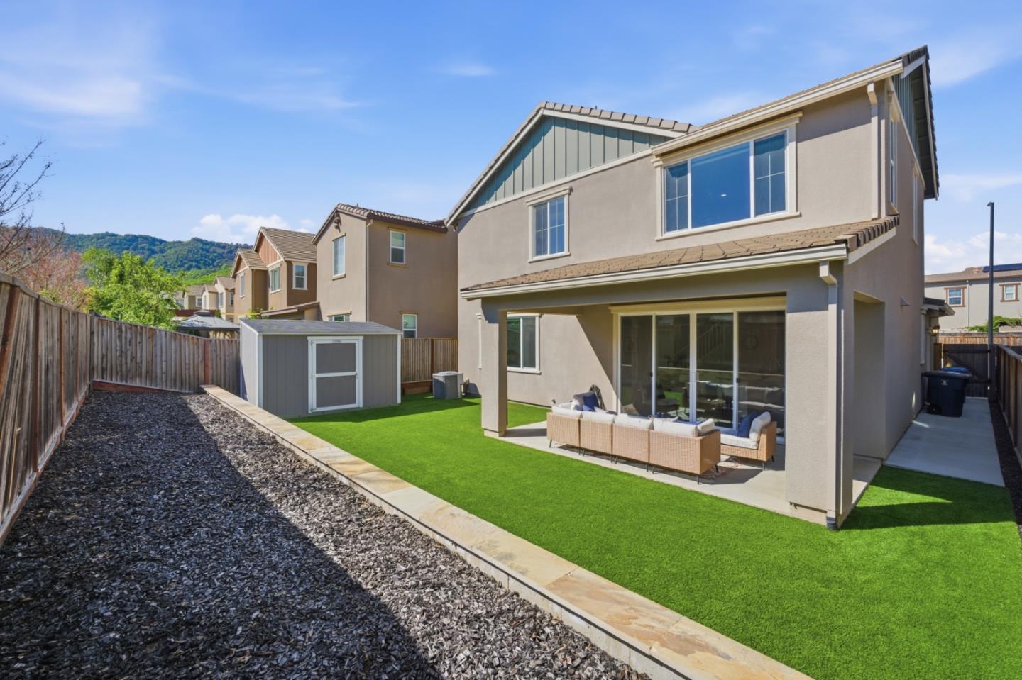 6430 Godani Street Gilroy, CA 95020 - Photo 32 of 38 a view of a house with a yard and sitting area