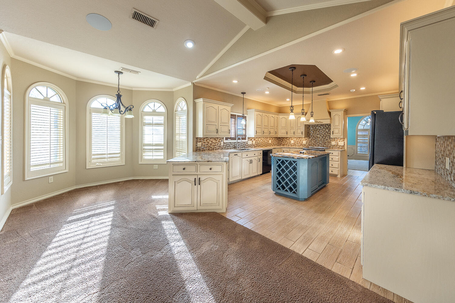 6604 3rd Street Lubbock, TX 79416 - Photo 13 of 46 a large kitchen with a large counter top appliances and cabinets