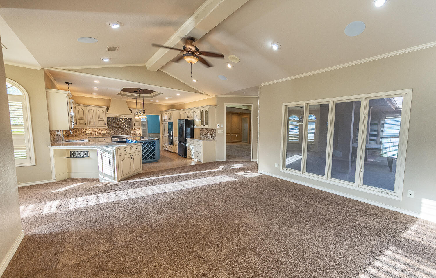 6604 3rd Street Lubbock, TX 79416 - Photo 14 of 46 a view of a kitchen with stainless steel appliances granite countertop a refrigerator a sink a stove and white cabinets