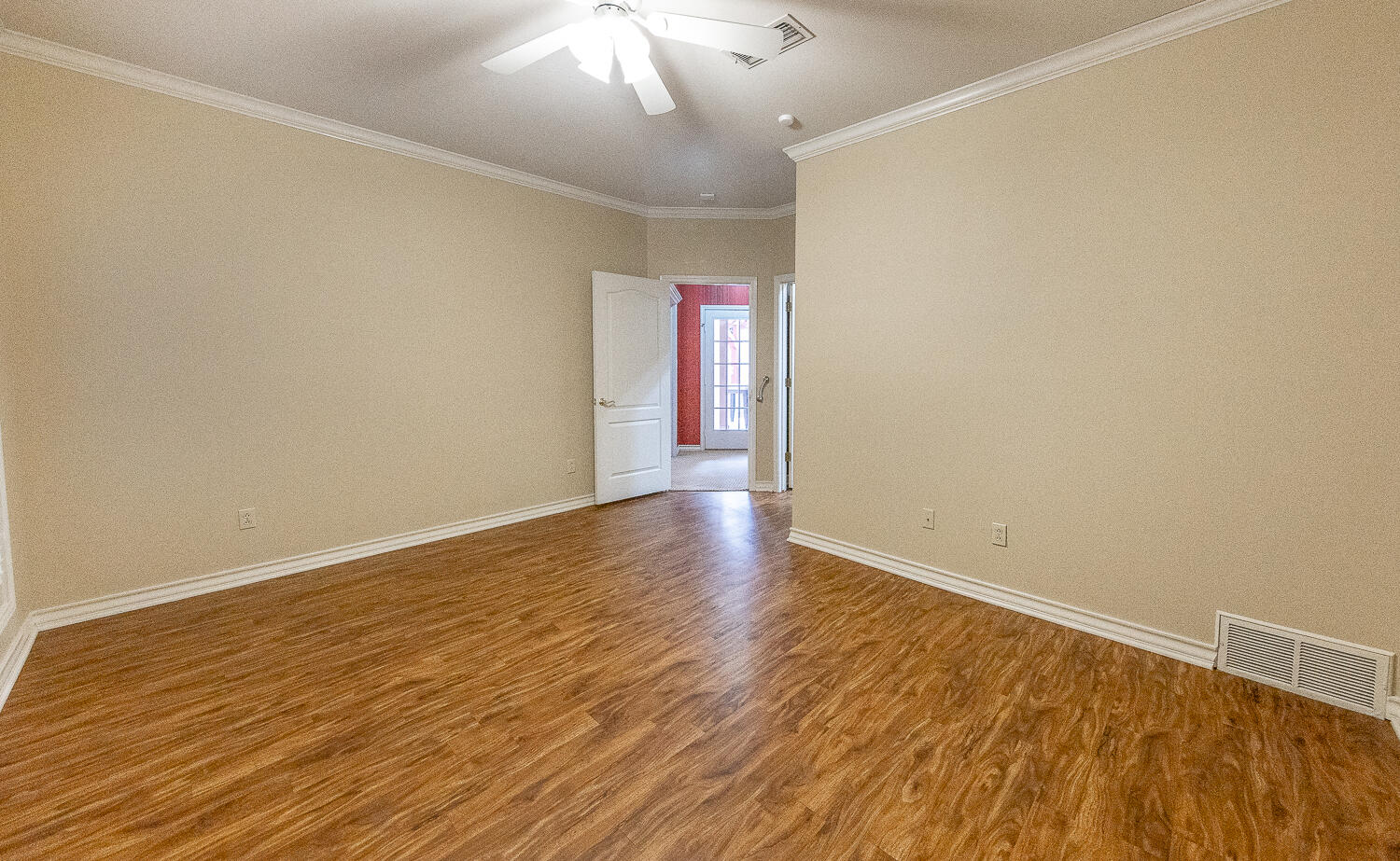 6604 3rd Street Lubbock, TX 79416 - Photo 21 of 46 an empty room with wooden floor and windows