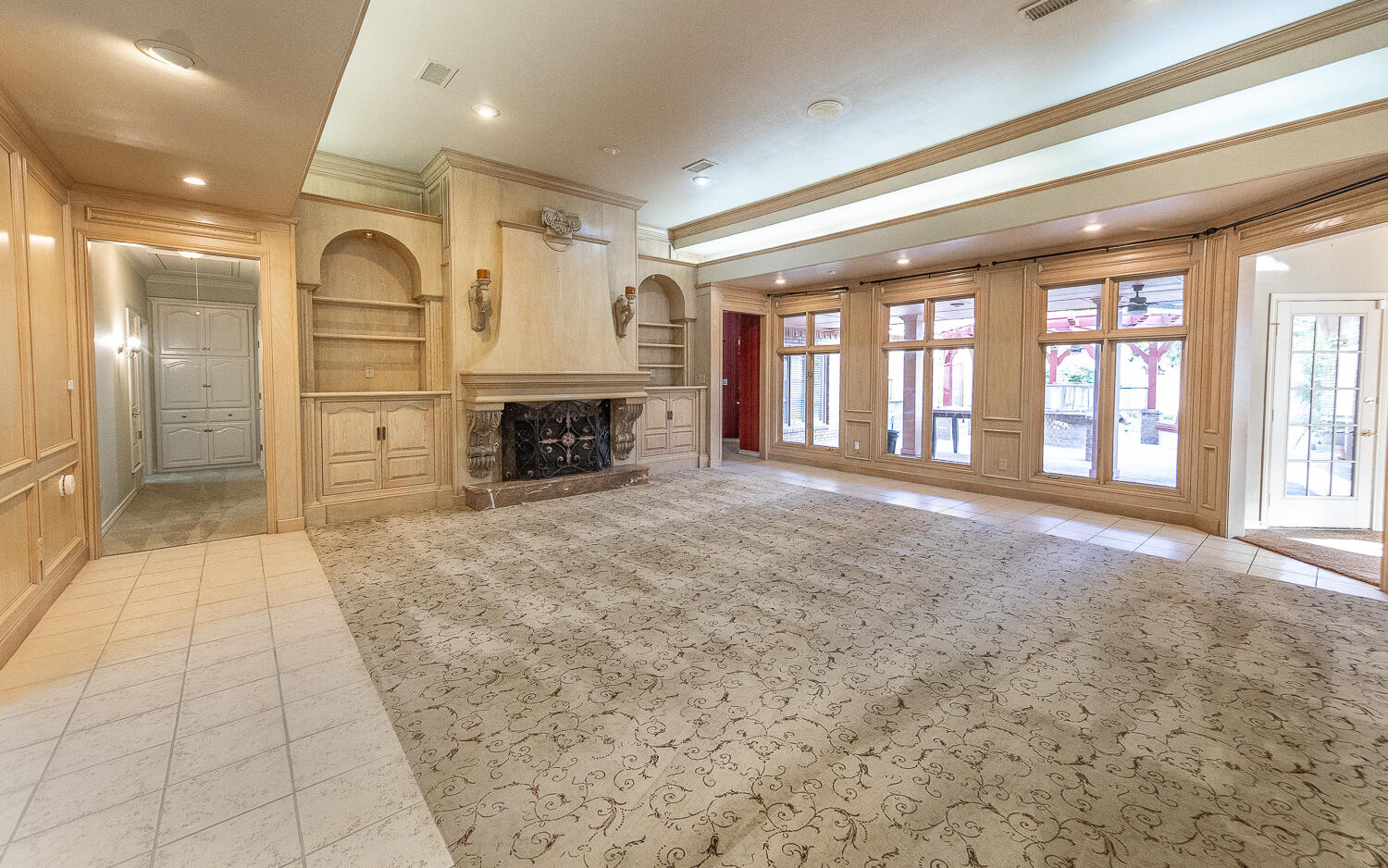 6604 3rd Street Lubbock, TX 79416 - Photo 4 of 46 a view of an empty room with a fireplace and a window